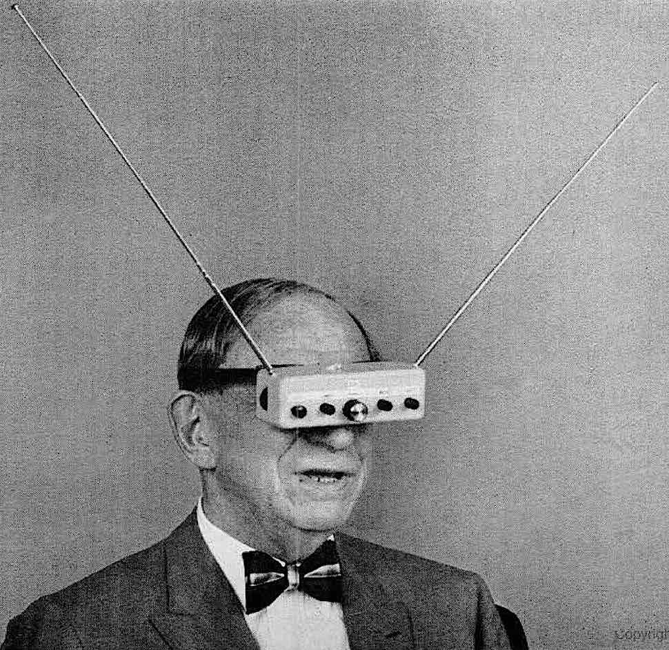 a photograph of 1963 television glasses strapped to a man's face