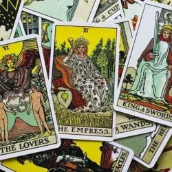 Spread of tarot cards including The Lovers, The Empress, and King of Swords, perfect for beginners in tarot reading.