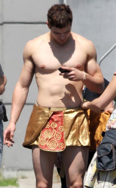 Shirtless Kellan Lutz getting sized up for his loincloth for his upcoming 
