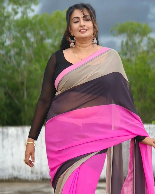 Maya Viswanath looking radiant in a pink saree, embodying timeless grace and sophistication.