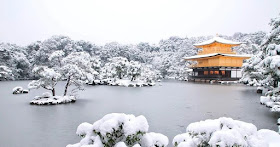 The spiritual Kinkaku-ji pavillon surrounded by greeneries in cold winter months in Kyoto, Japan