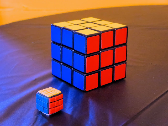 Nerdy Thirty Cake - Fondant Rubik's Cube Decoration next to Real Rubik's Cube