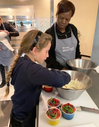 Girl preparing a dish at The Good Food Studio 