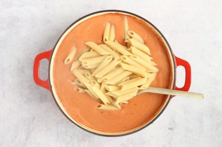 Adding the Penne to the Tomato and Vodka Sauce