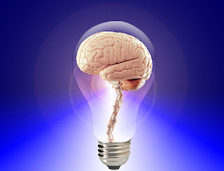 Blue background image of a brain inside a light bulb