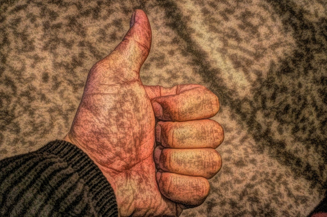 left hand thumbs up