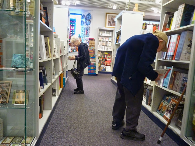 elderly couple shopping bookstore