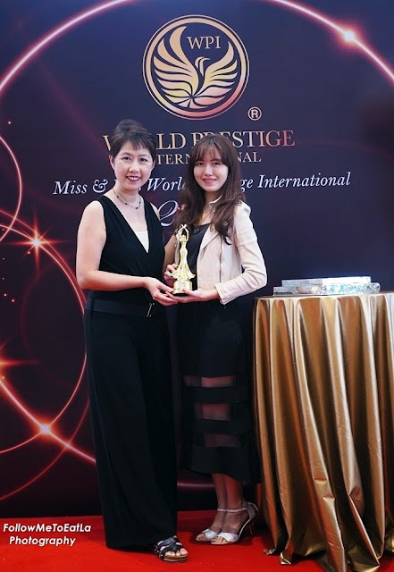 Mummy & Daughter Posting With The Pageant Trophy