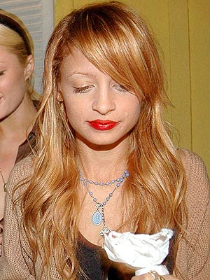 With a braid: (Perfect inspiration for braid, boho type hair: Nicole Richie)