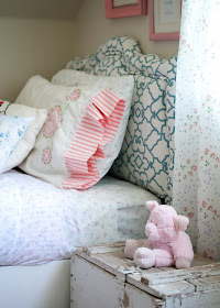 Recovered vintage headboard, DIY bed, vintage linens and old toolbox