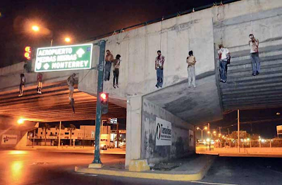 Image result for mexico bodies hanging from bridge