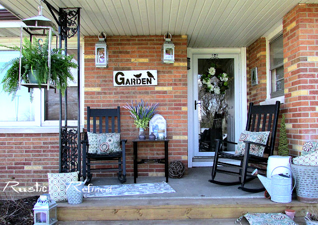 Porch Patio area decorated for the Spring season, using rustic and industrial touches for a Modern Farmhouse Feel.