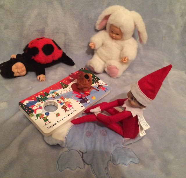 Elf on the shelf reading a story to toys