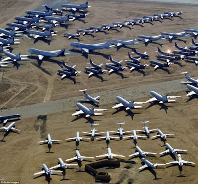 abandoned Military airplanes rusting in the desert... a total waste of taxpayer dollars... meme gvan42