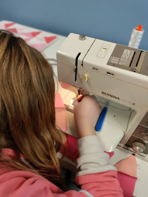Kids sewing blocks for an Exploding Heart quilt