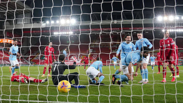 Man City midfielder Ilkay Gundogan scores against Liverpool