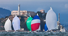 J/105s planing downwind from Alcatraz to Blossom Buoy- off San Francisco waterfront- epic sailing conditions