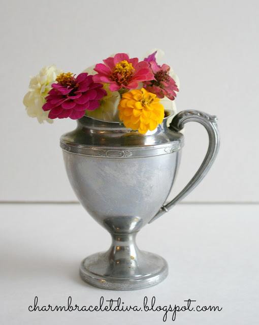 Vintage silver plate pitcher with detailed etching