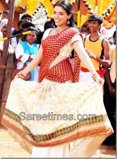 Bollywood and South Indian actress Asin in red and cream designer half saree