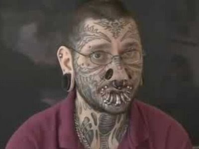 stern tattoo. tattoo on face.