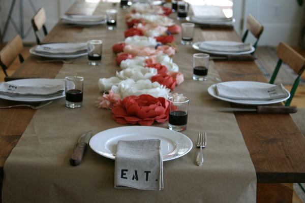 Above a simple burlap runner without a table cloth looks great at this 