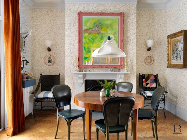 Beata Heuman dining room with patterned wallpaper, traditional dining set, and modern fabric hanging pendant light