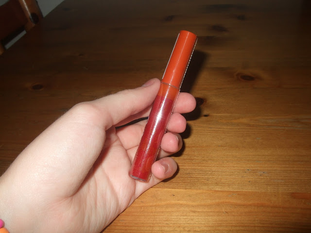 red sparkly lipgloss with orange lid