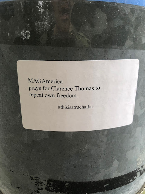 Sticker: "MAGAmerica/prays for Clarence Thomas to/repeal own freedom."   #thisisatruehaiku