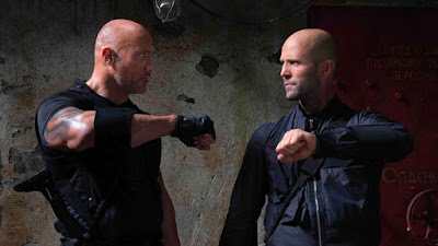 Movie still for the new Fast and Furious film Hobbs and Shaw where Dwayne Johnson and Jason Statham argue in military gear before they go into battle
