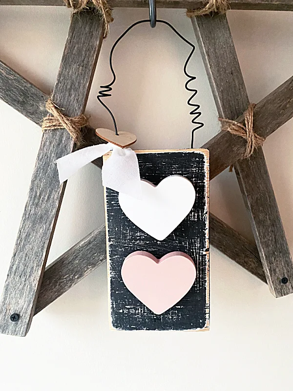 rustic heart sign hanging on wooden star