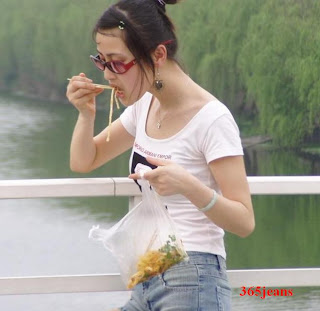 Eat noodles jeans shorts beauty girl