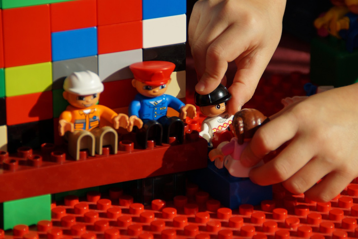 child playing with Lego