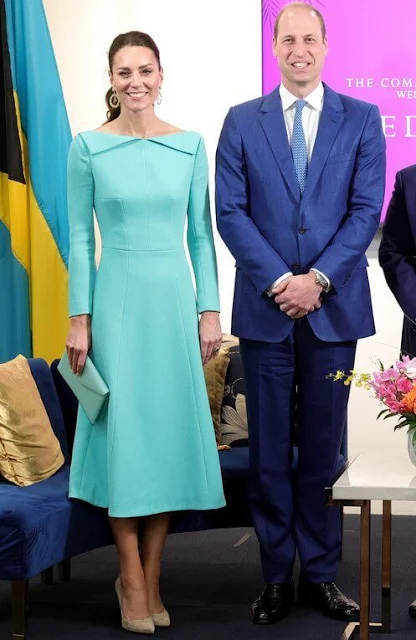 Kate Middleton wore a bespoke aquamarine fitted dress by Emilia Wickstead. Sezane Taylor earrings in turquoise