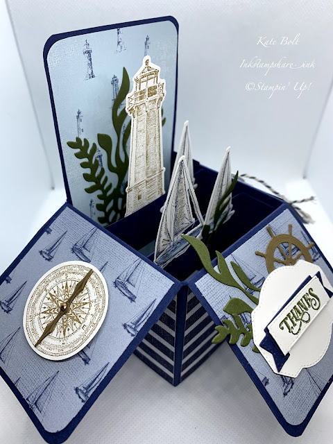 This is the side view of a card in a box with boats, light house, anchor, compass and seaweed, using the Lets Sail Away stamps, dies and paper from Stampin Up