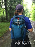 Man wearing a Thule Capstone backpack.