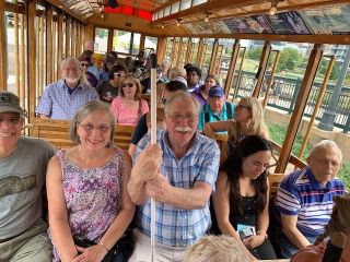 Blind seniors enjoy seasonal open-air trolley offering scenic rides along the South Platte Greenway & Downtown Denver.