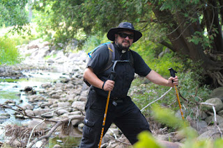 Fr. Andrew Kurz, administrator of St. Thomas the Apostle Parish in Humboldt and St. Joseph Parish in Champion, is pictured at Bruemmerville County Park near Algoma. The priest will begin a walking pilgrimage from Champion to Hubertus this Sunday. (Brian J. Sealey, NMO Media Company | Special To THE COMPASS)