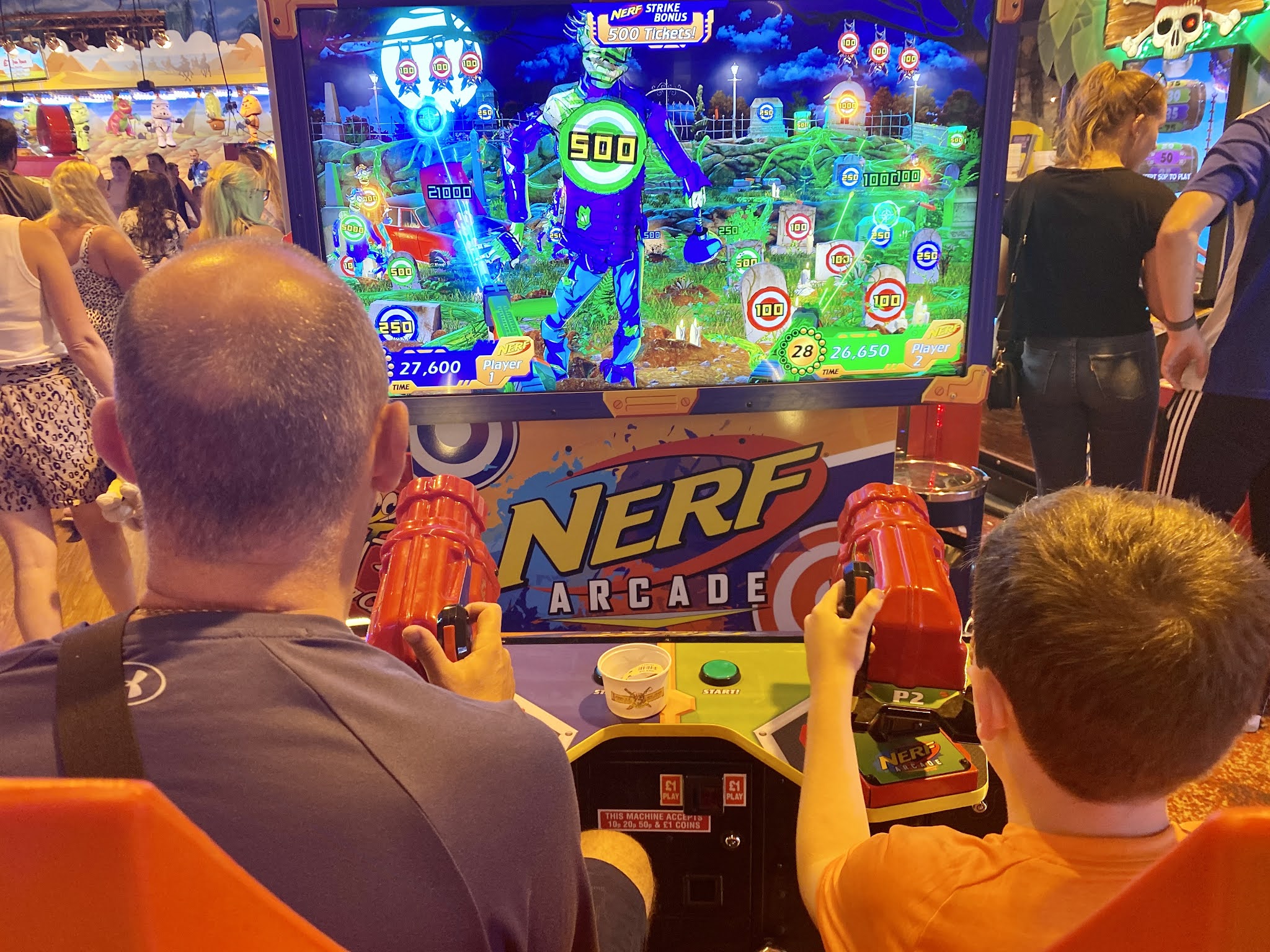 playing Nerf game in arcade