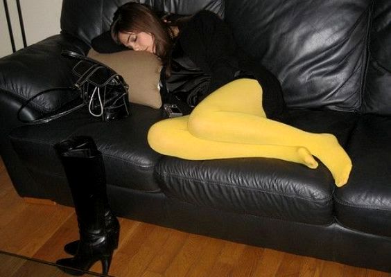 Beautiful woman in yellow tights without boots and dreaming of beautiful things