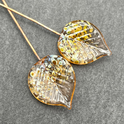 Handmade lampwork glass headpins by Laura Sparling