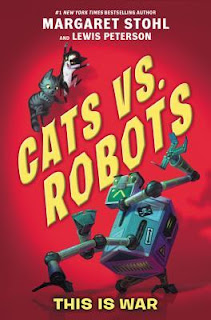 Book cover, Cats vs. Robots, This is War, by Margaret Stohl and Lewis Peterson. Image depicts two cats, positioned above the title letters, looking down at a robot that's beneath the lettering. The robot brandishes claw-like appendages and glares at the cats.