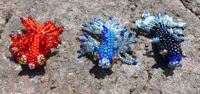 Three Fancy Fish by Alison Oman with peyote stitch bodies