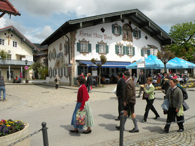 Locals stroll in their Sunday-best dirndls and lederhosen in Oberammergau. Photograph by Janie Robinson, Travel Writer