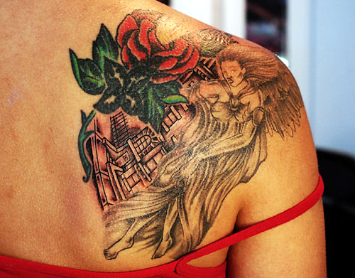 Girl with rose shoulder tattoo