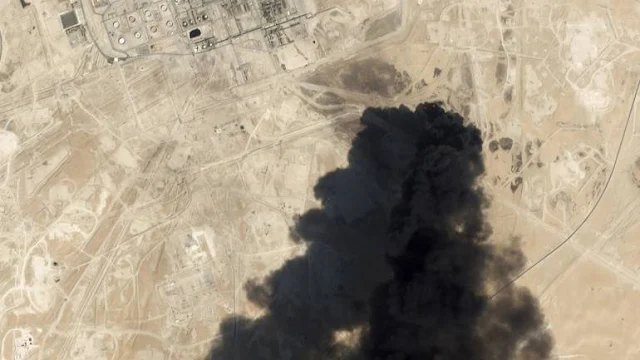 Image Attribute: Satellite image from Planet Labs Inc. shows thick black smoke rising from Saudi Aramco's Abqaiq facility in Buqyaq / Dated: September 14, 2019.