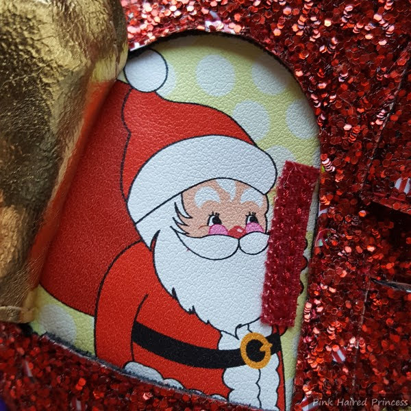 day 12 image of advent calendar boots of Santa