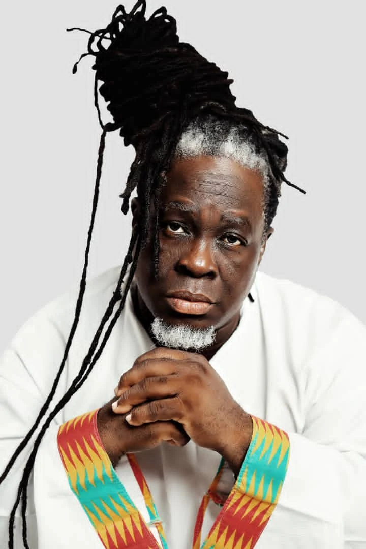 A man called Shasha marley with dreadlocks wearing a white shirt.