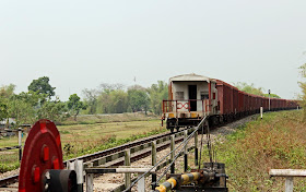 goods train leaving a level crossing