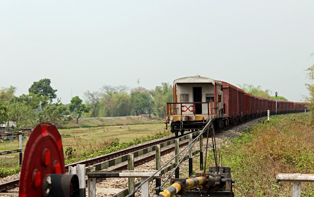 goods train leaving a level crossing