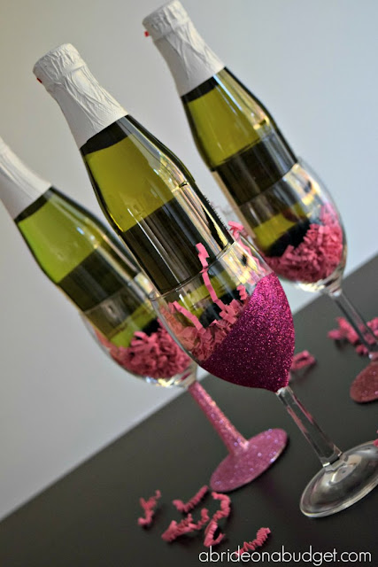 #ad Looking for a sparkling DIY? Check out these glitter wine glasses -- with an added sparkling juice -- from www.abrideonabudget.com. #dollartree